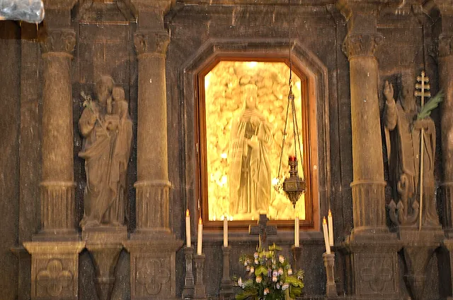 The main altar of St Kinga's Chapel, carved in salt and lit from behind